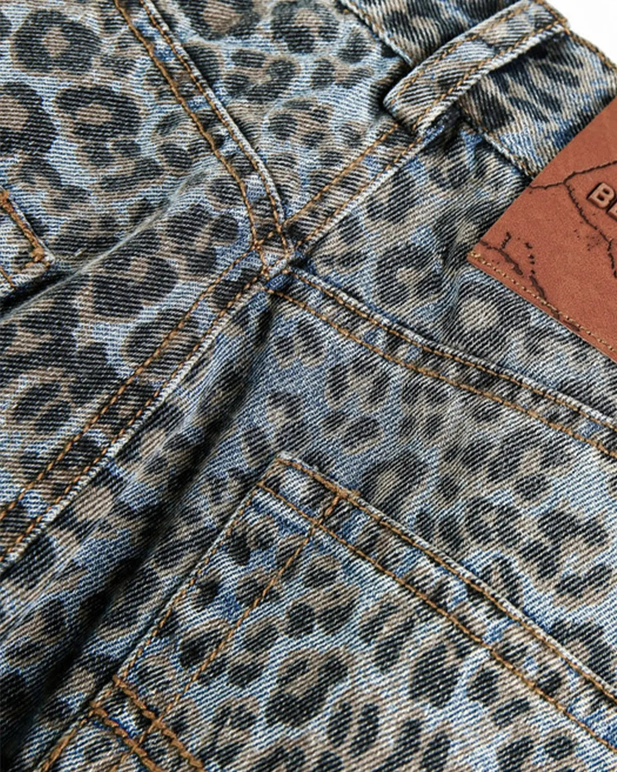 Vintage leopard print barrel jeans by INFLATION featuring bold animal print and relaxed fit, styled with casual streetwear appeal.