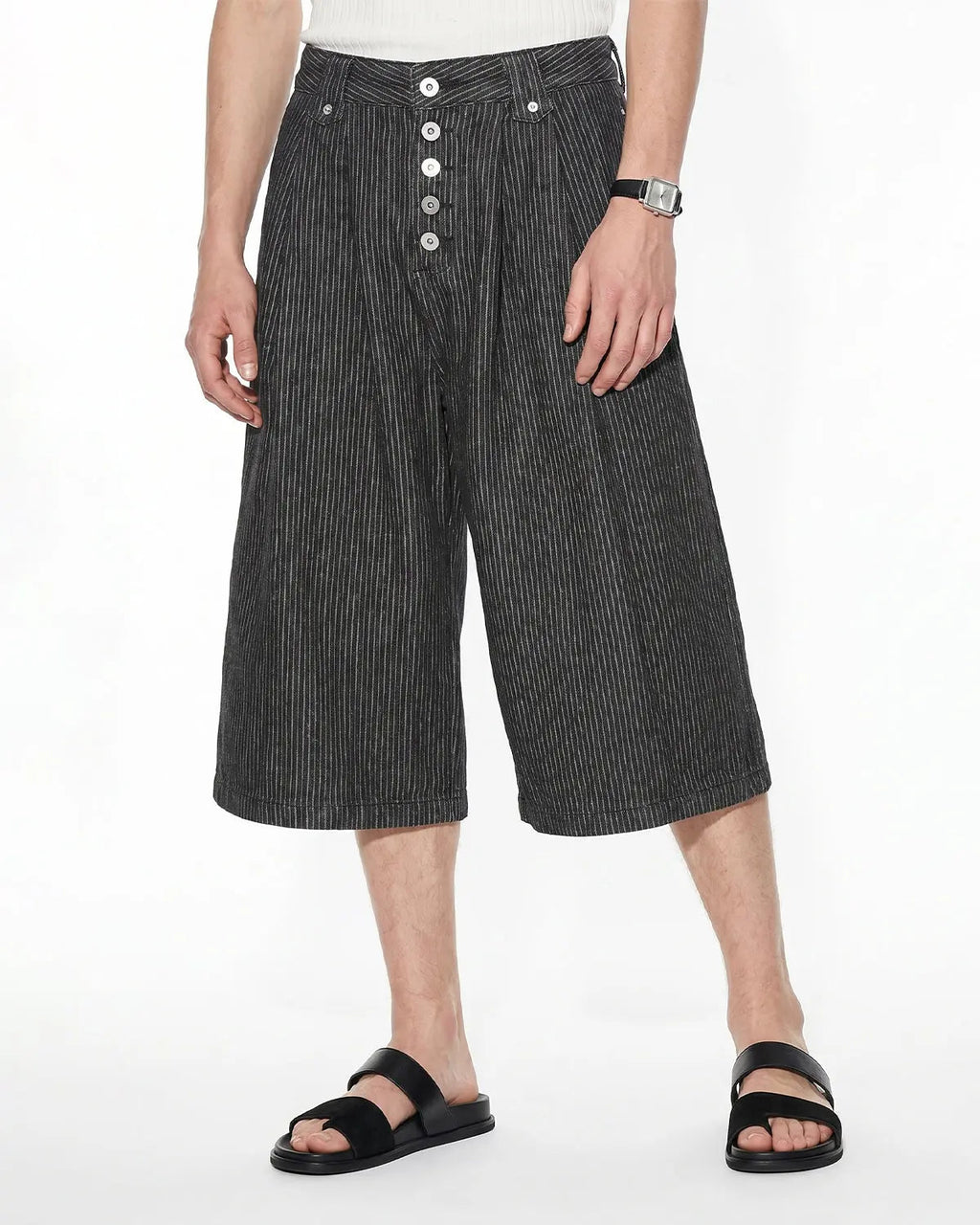 Inflation Streetwear striped button fly baggy jorts, casual denim pants with bold stripe pattern and relaxed fit, front view.