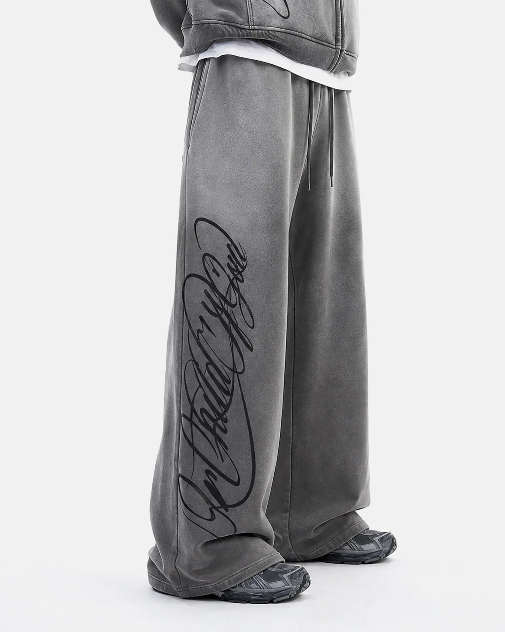 Acid washed Flation Streetwear sweatpants featuring a relaxed fit, soft fabric, and trendy distressed style.