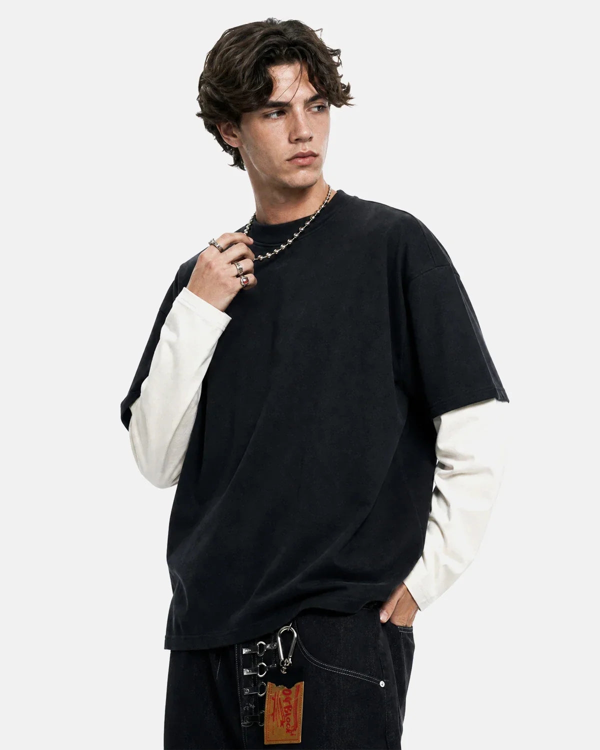 Color block long sleeve tee from Flation Streetwear, featuring bold color blocking and a relaxed fit on a casual model.