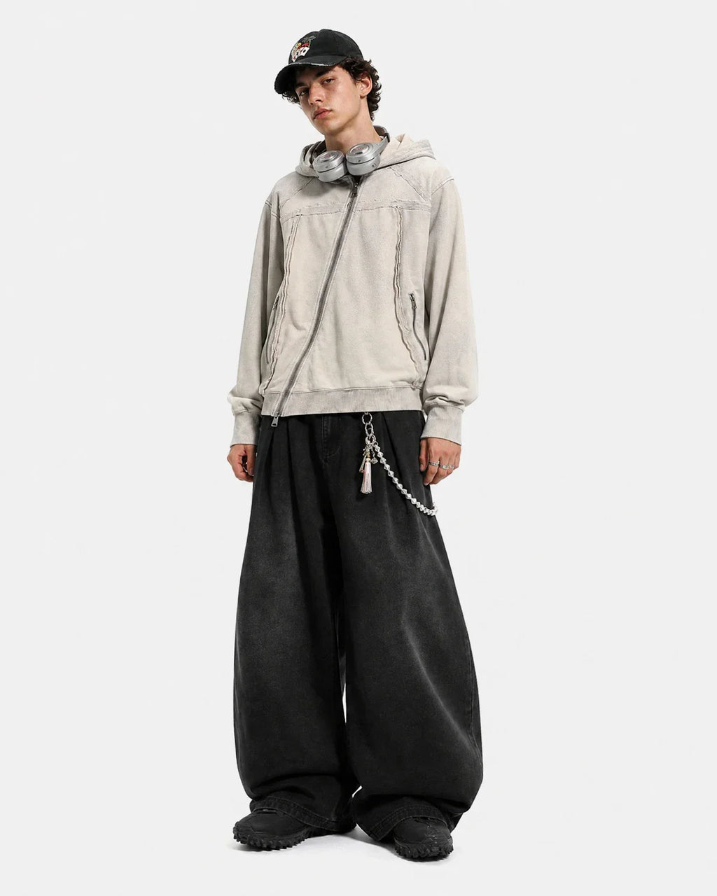 Washed boxy asymmetric zip-up hoodie by INFLATION, featuring a relaxed fit and unique design details, displayed on a mannequin.