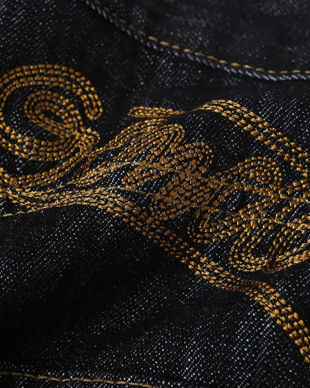 Embroidered raw baggy jeans by INFLATION featuring streetwear style with detailed embroidery and relaxed fit.