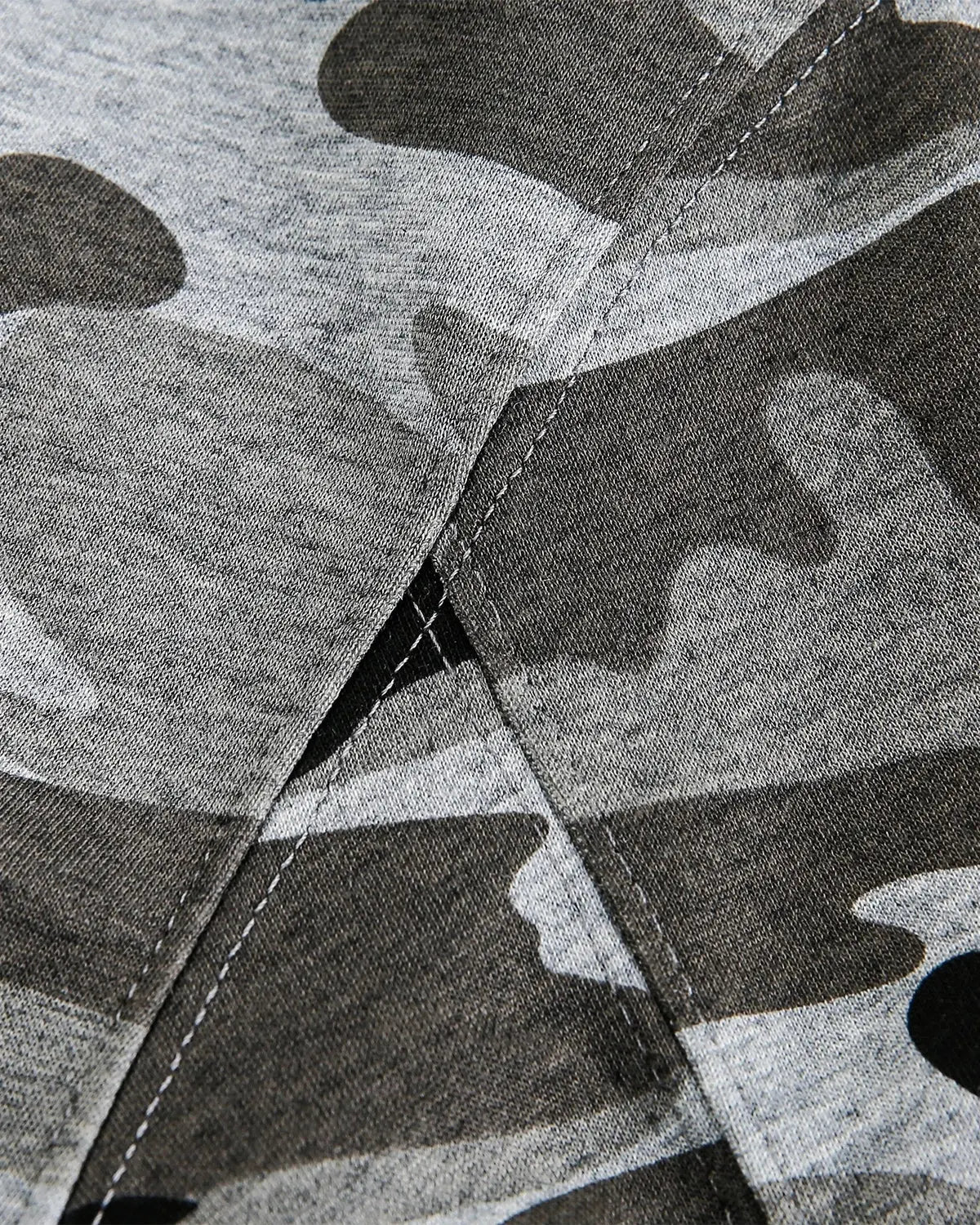 Inflation streetwear cropped camouflage zip-up hoodie with front pockets and adjustable hood, styled with a casual urban look.