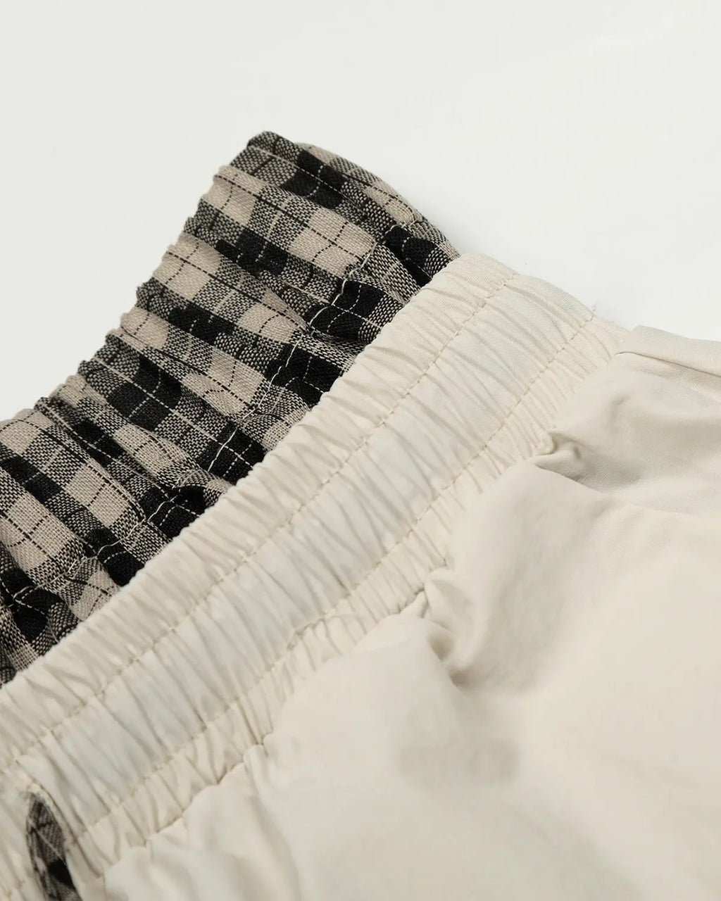 Inflation streetwear plaid double waist baggy track pants with relaxed fit and tapered legs, featuring a stylish checkered pattern.