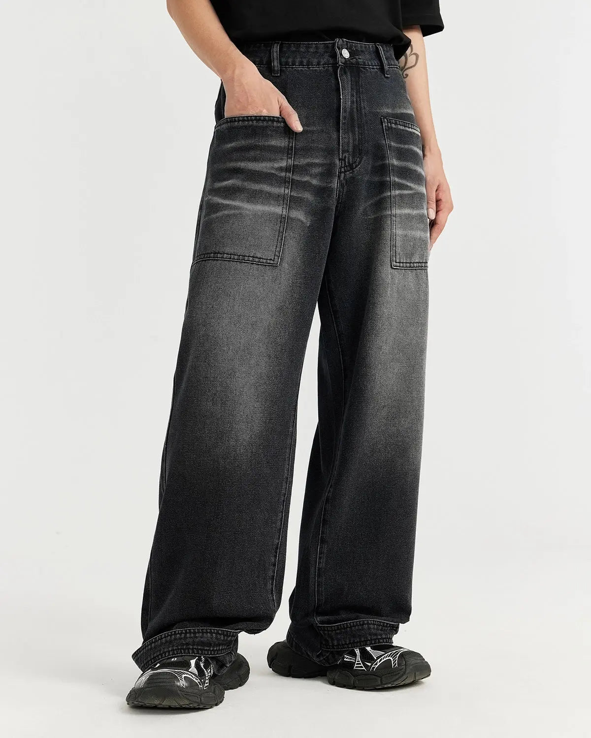 Black washed baggy jeans by Flation Streetwear, featuring a relaxed fit with distressed details and casual street style.