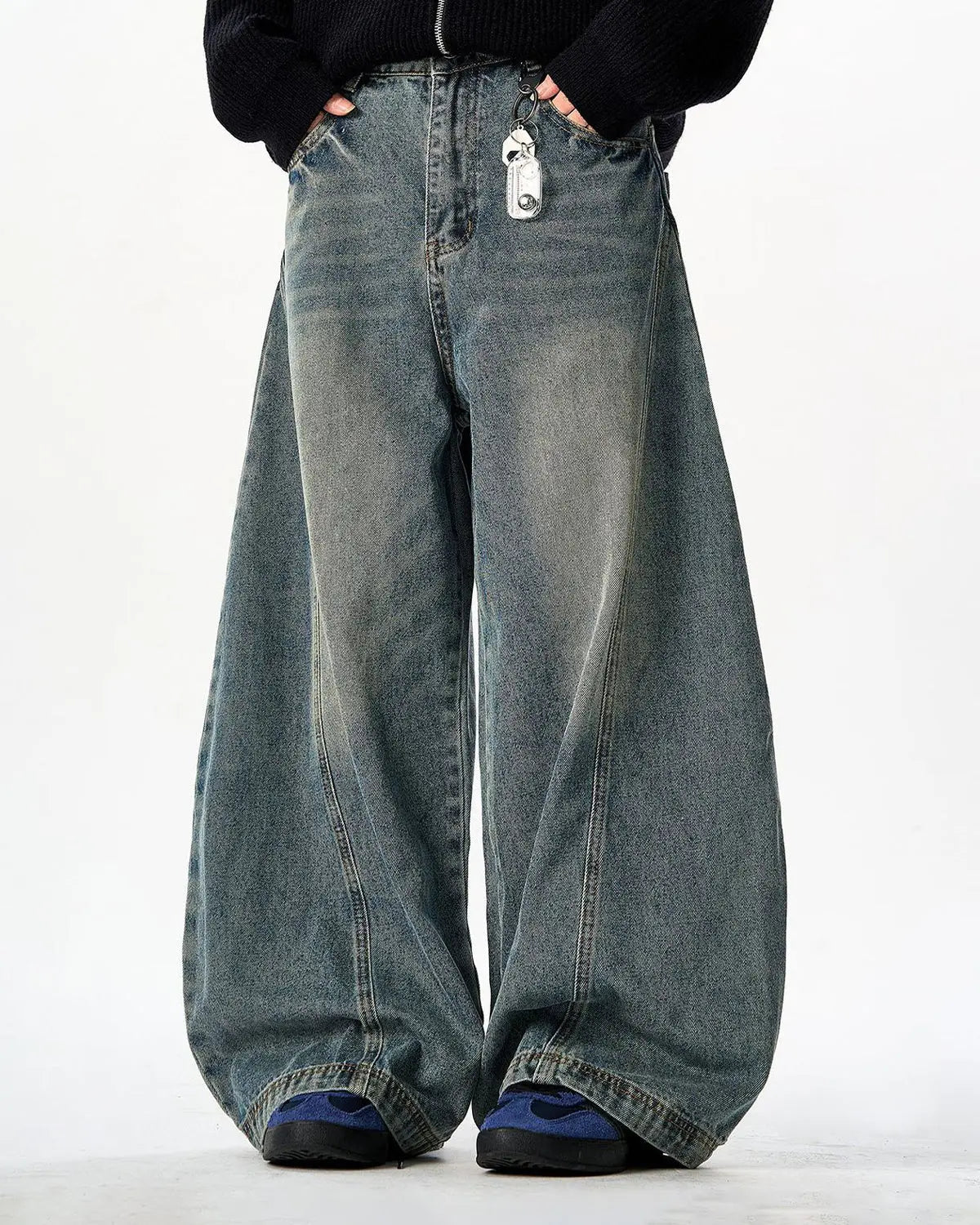 Vintage washed barrel jeans by INFLATION, showing relaxed fit denim with distressed detailing and classic five-pocket style.