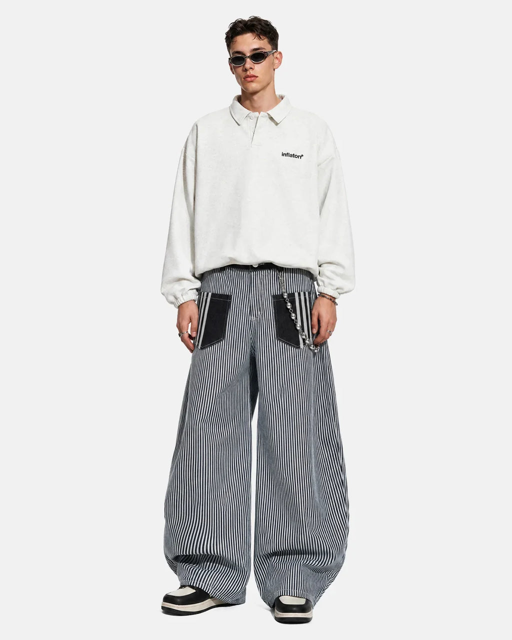 Inflation Streetwear striped patch pocket baggy jeans with relaxed fit and casual style, featuring bold stripe design and patch pockets.