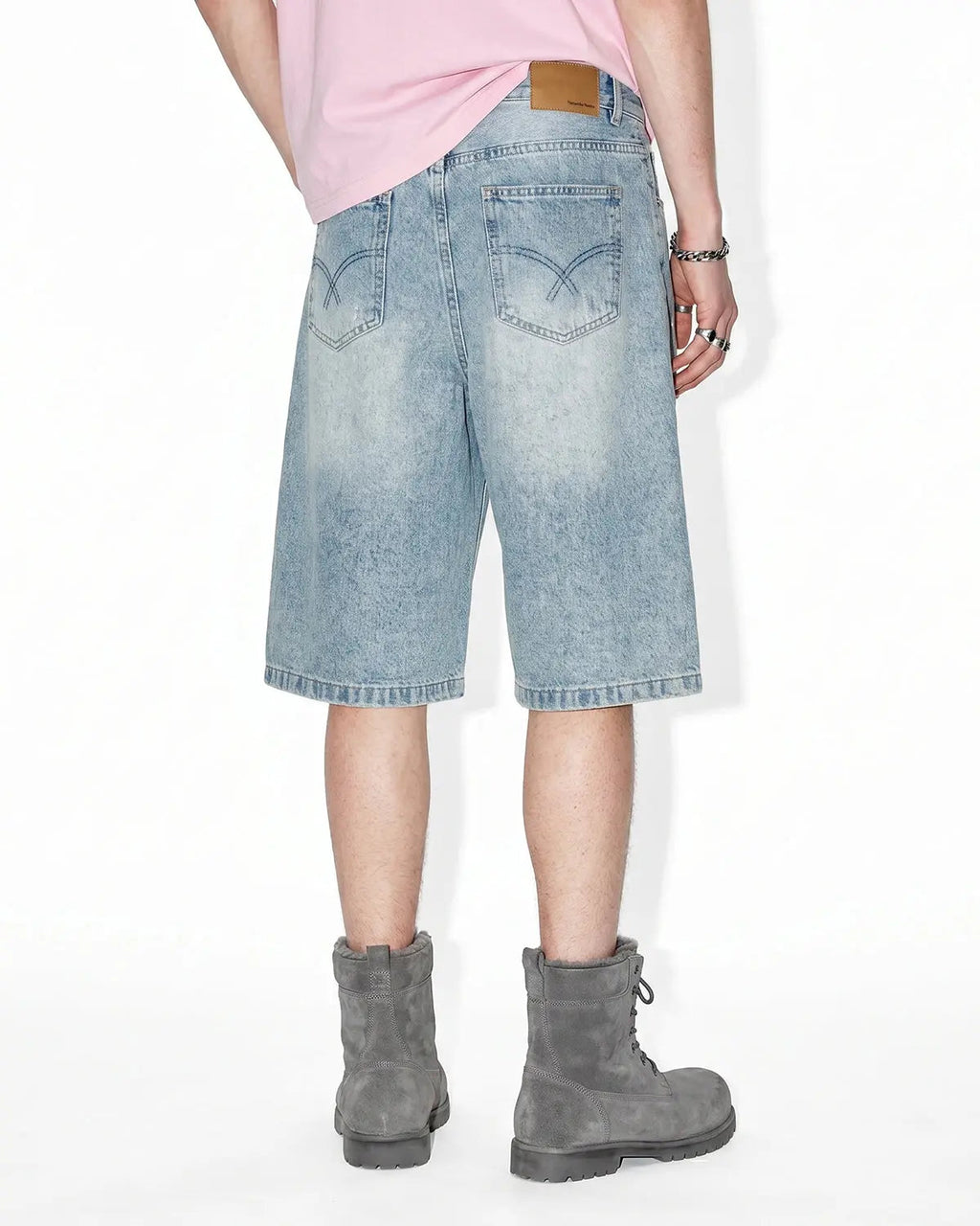 Distressed longline jorts from Inflation Streetwear, denim pants with ripped details and a relaxed, oversized fit.