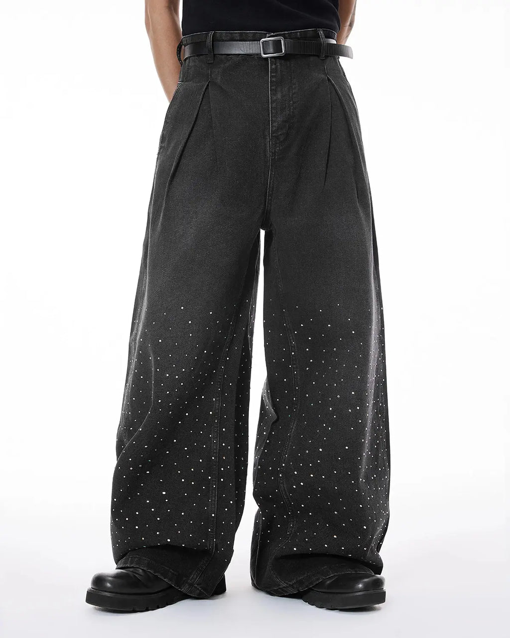 Acid washed rhinestone baggy jeans by Flation, streetwear style, showing the distressed denim fabric and rhinestone details.
