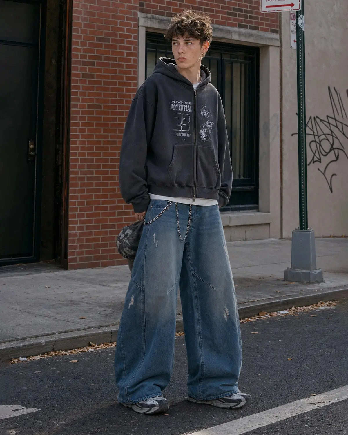 Distressed ripped baggy jeans from Flation Streetwear, showcasing a loose fit with torn details and casual street style.