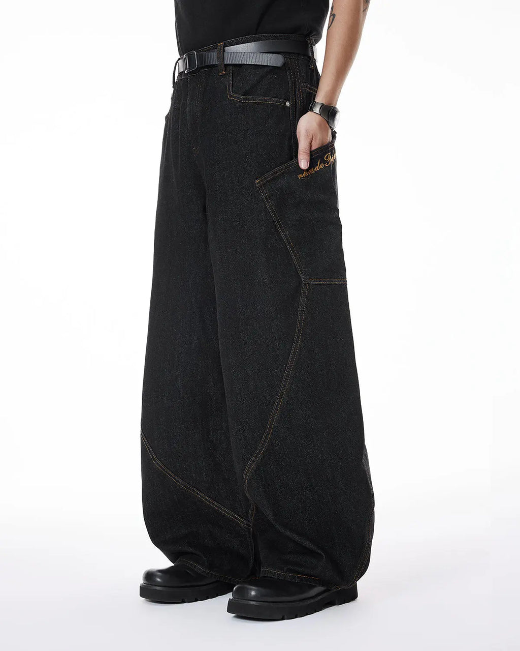 Colorful rhinestone raw barrel jeans by Flation featuring vibrant embellishments and distressed denim style.