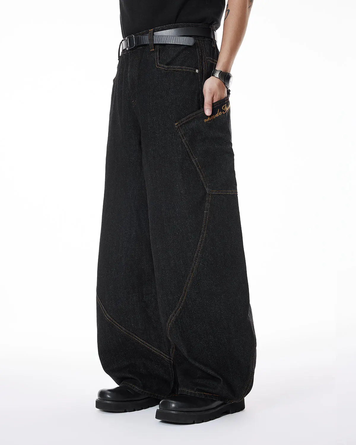 Colorful rhinestone raw barrel jeans by Flation featuring vibrant embellishments and distressed denim style.