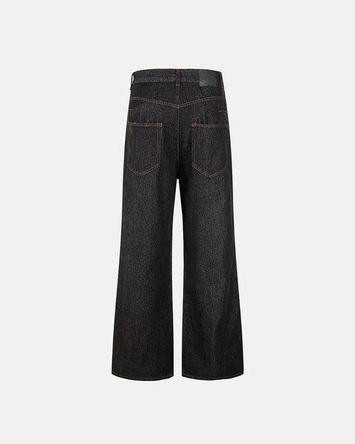 Asymmetric buckle raw baggy jeans by INFLATION featuring oversized fit, distressed denim, and bold design details.