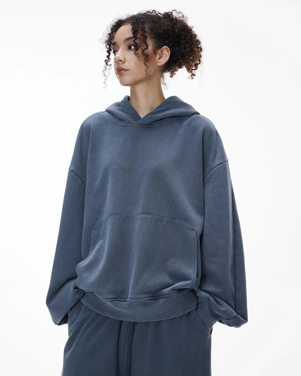Inflation Streetwear garment washed French Terry hoodie with a relaxed fit, featuring a drawstring hood and soft, textured fabric.