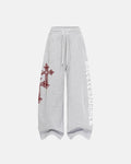 Inflation Cross Print Baggy Sweatpants featuring bold cross design, relaxed fit, and comfortable streetwear style in soft fabric.