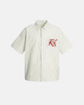 Striped embroidered short-sleeve shirt by INFLATION featuring colorful stripes and detailed embroidery on soft fabric.