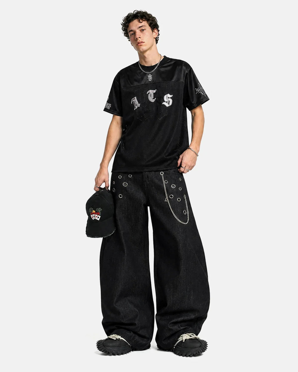 Inflation Metal Eyelet Chain Barrel Jeans featuring distressed denim, metal eyelets, and chain details for a streetwear look.