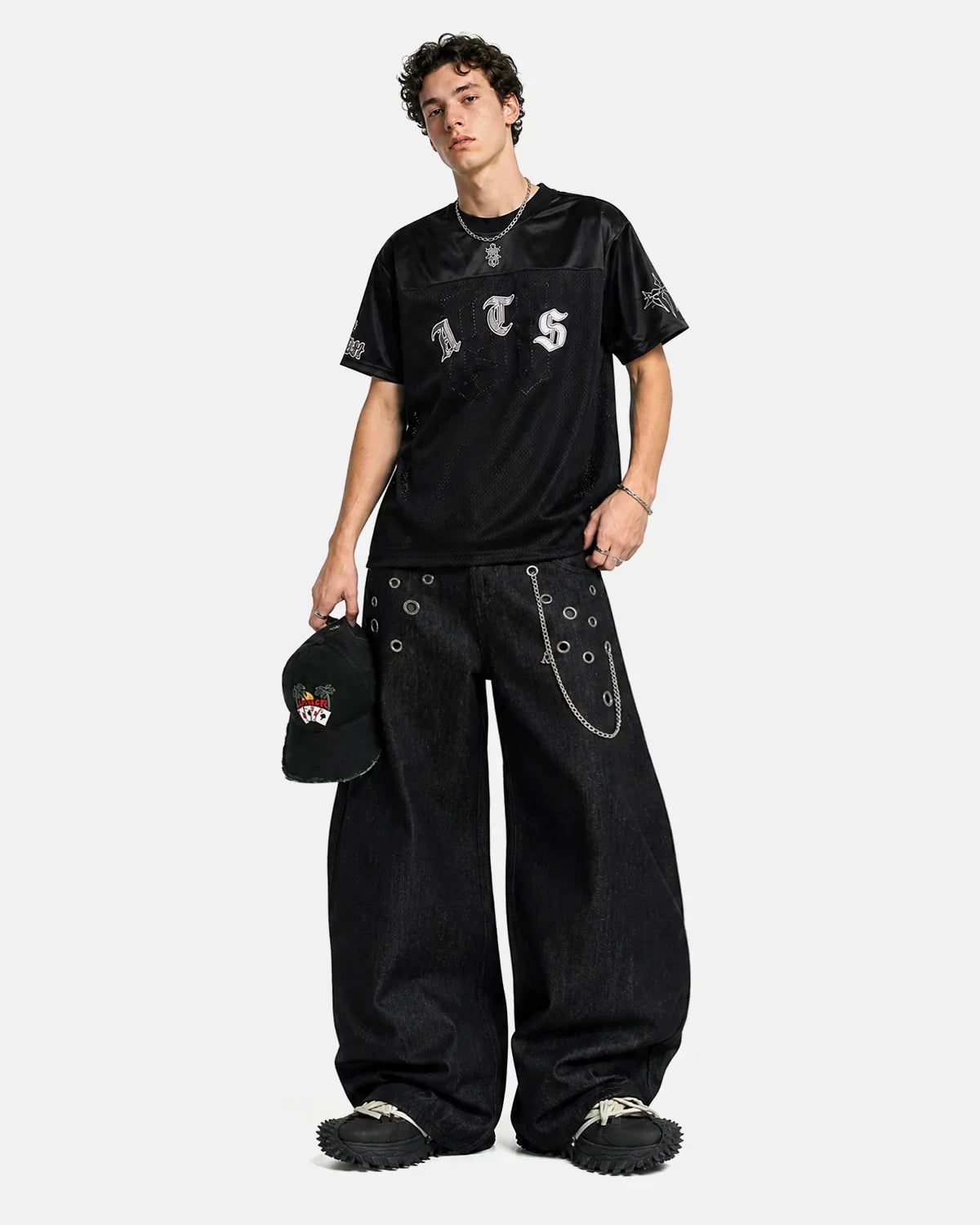 Inflation Metal Eyelet Chain Barrel Jeans featuring distressed denim, metal eyelets, and chain details for a streetwear look.
