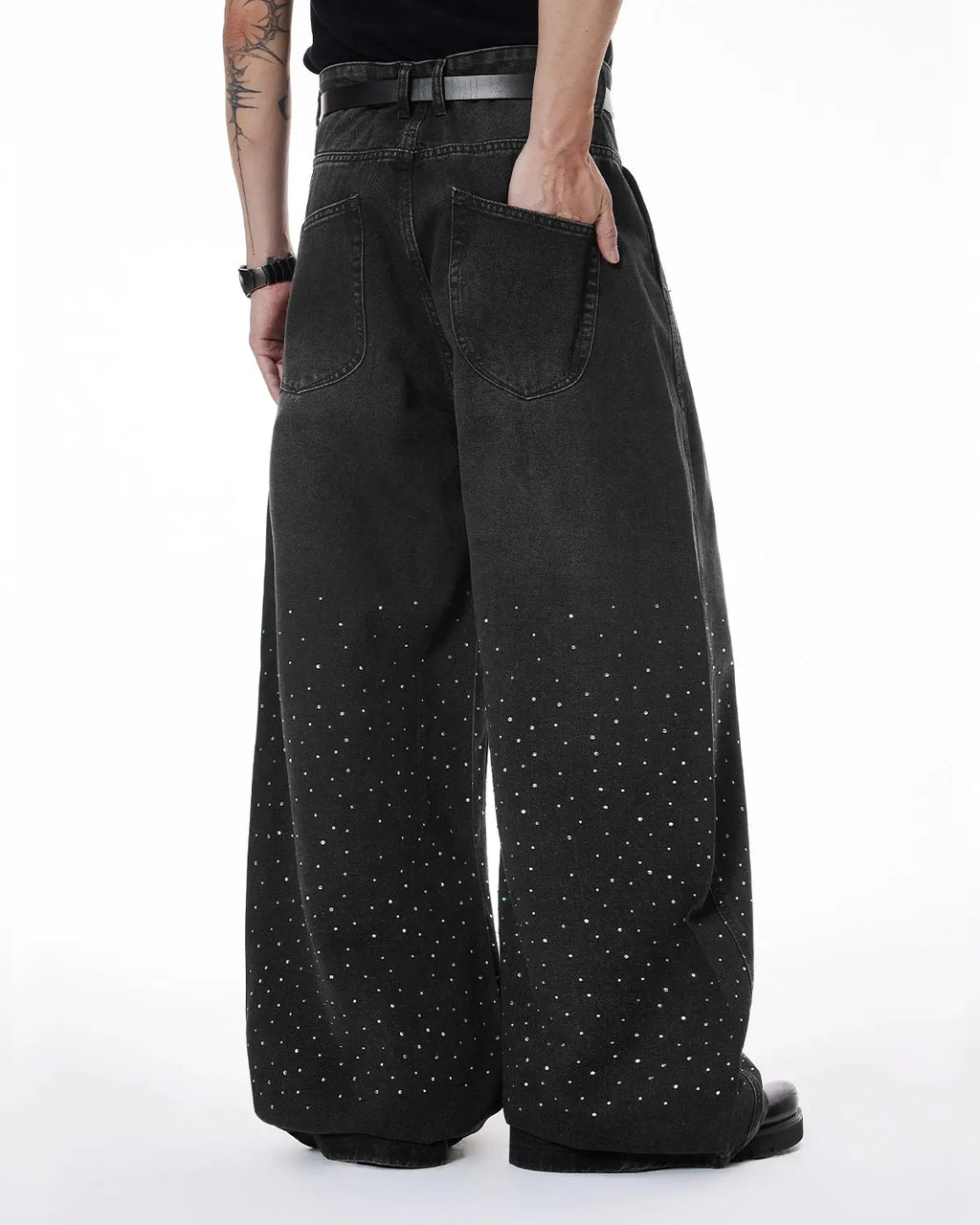Acid washed rhinestone baggy jeans by Flation Streetwear, featuring distressed denim with rhinestone embellishments and relaxed fit.