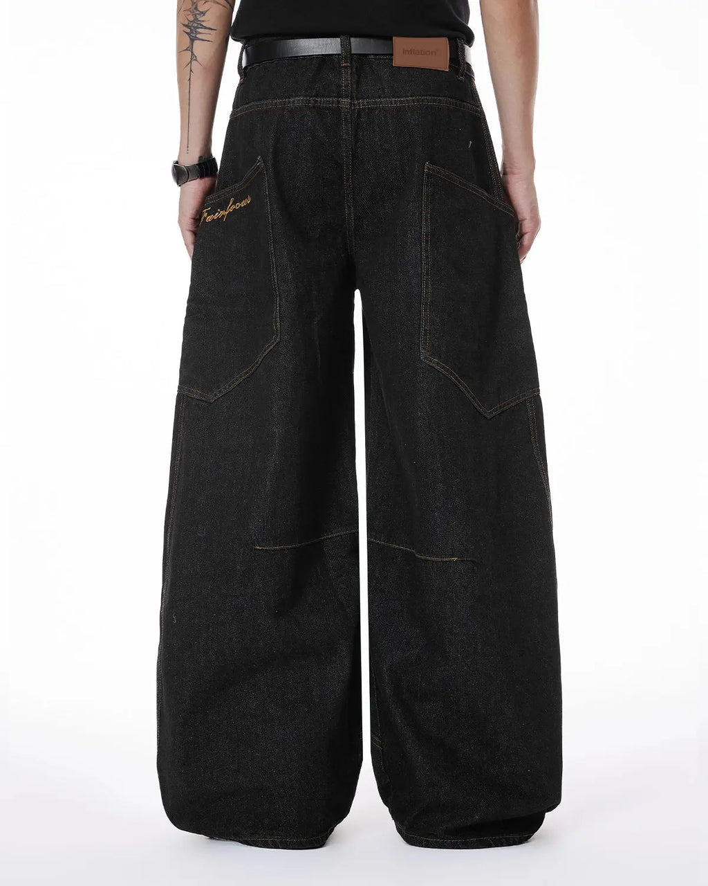 Colorful rhinestone raw barrel jeans by Flation Streetwear featuring vibrant rhinestone embellishments and a relaxed raw hem fit.
