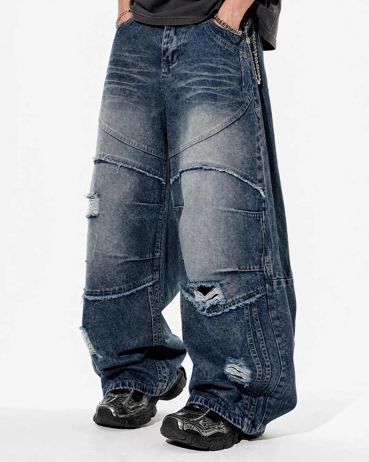 Inflation streetwear Cinch Back Deconstructed Distressed Barrel Jeans, stylish denim pants with distressed details and a cinch back design.