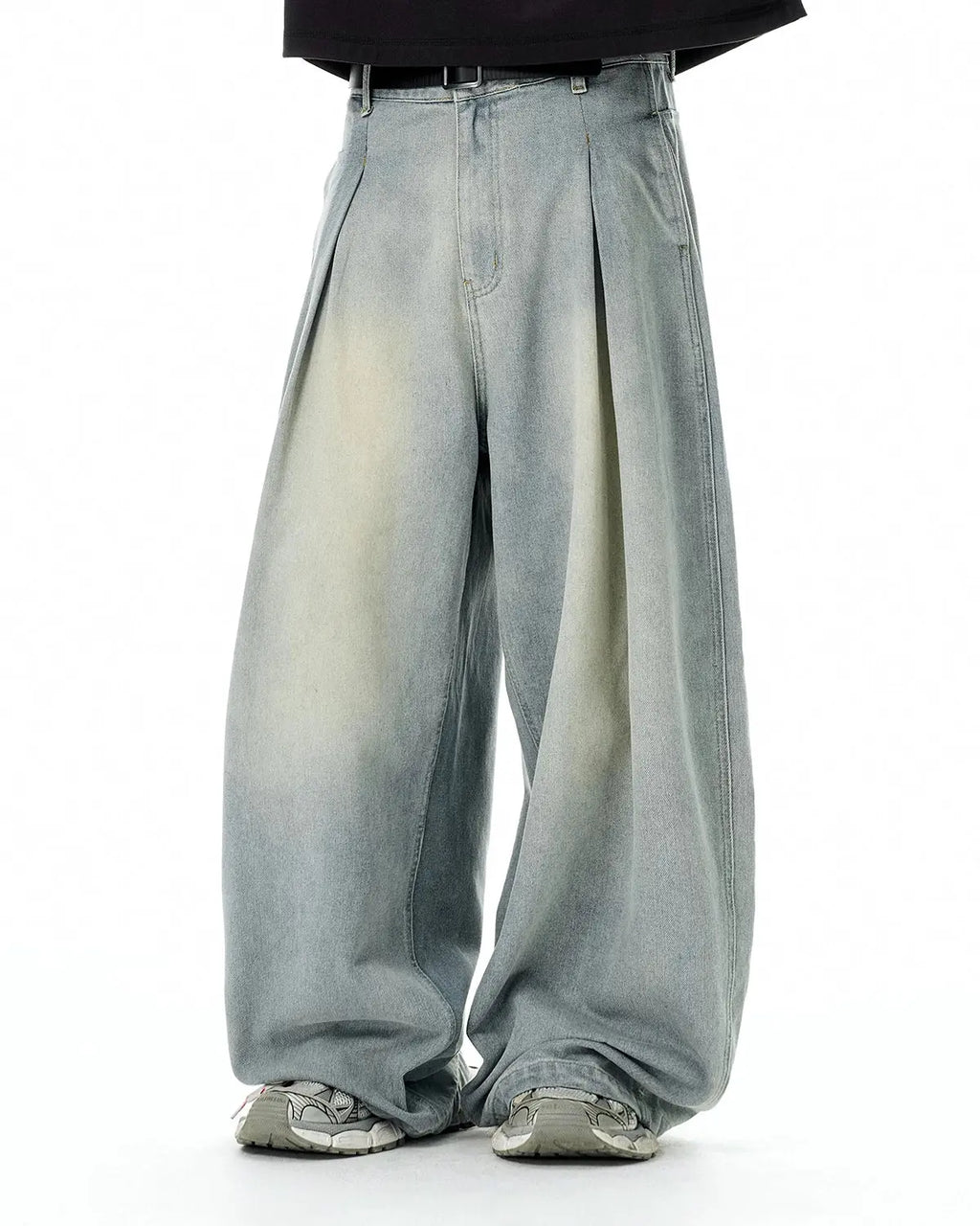 Acid washed super baggy jeans by Flation Streetwear, showing relaxed fit, distressed denim, and oversized style in a casual setting.