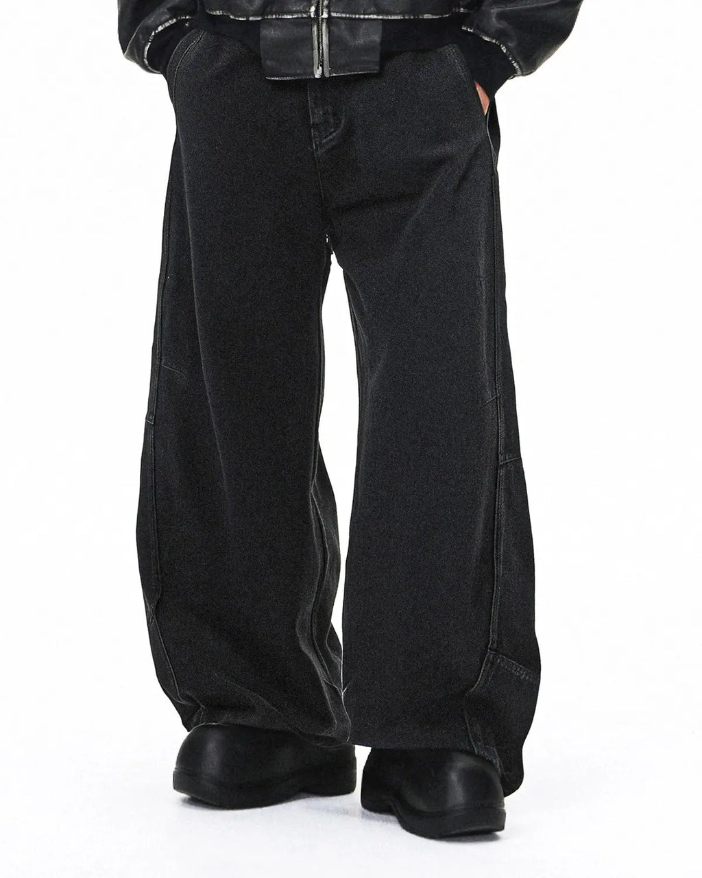 Acid washed black barrel jeans by Flation featuring a relaxed fit, distressed details, and classic five-pocket design.