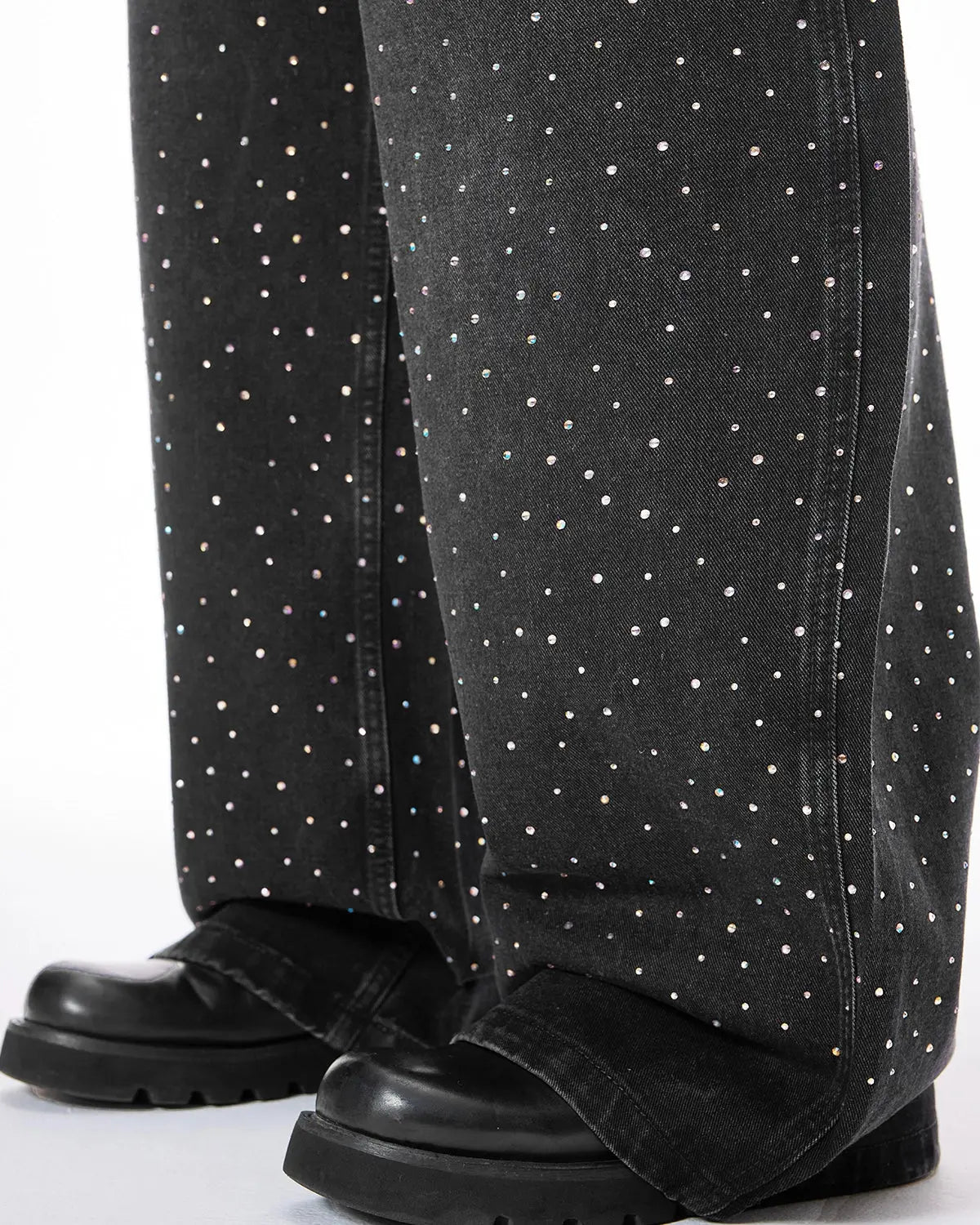 Acid washed rhinestone baggy jeans by Flation Streetwear, showing distressed fabric, rhinestone embellishments, and relaxed fit.