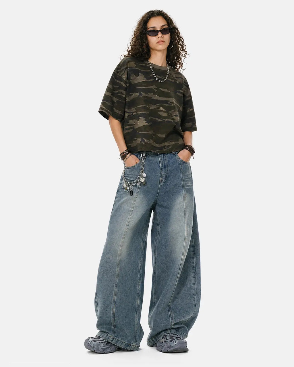 Deconstructed washed barrel jeans by INFLATION Streetwear featuring distressed details and unique patchwork design.