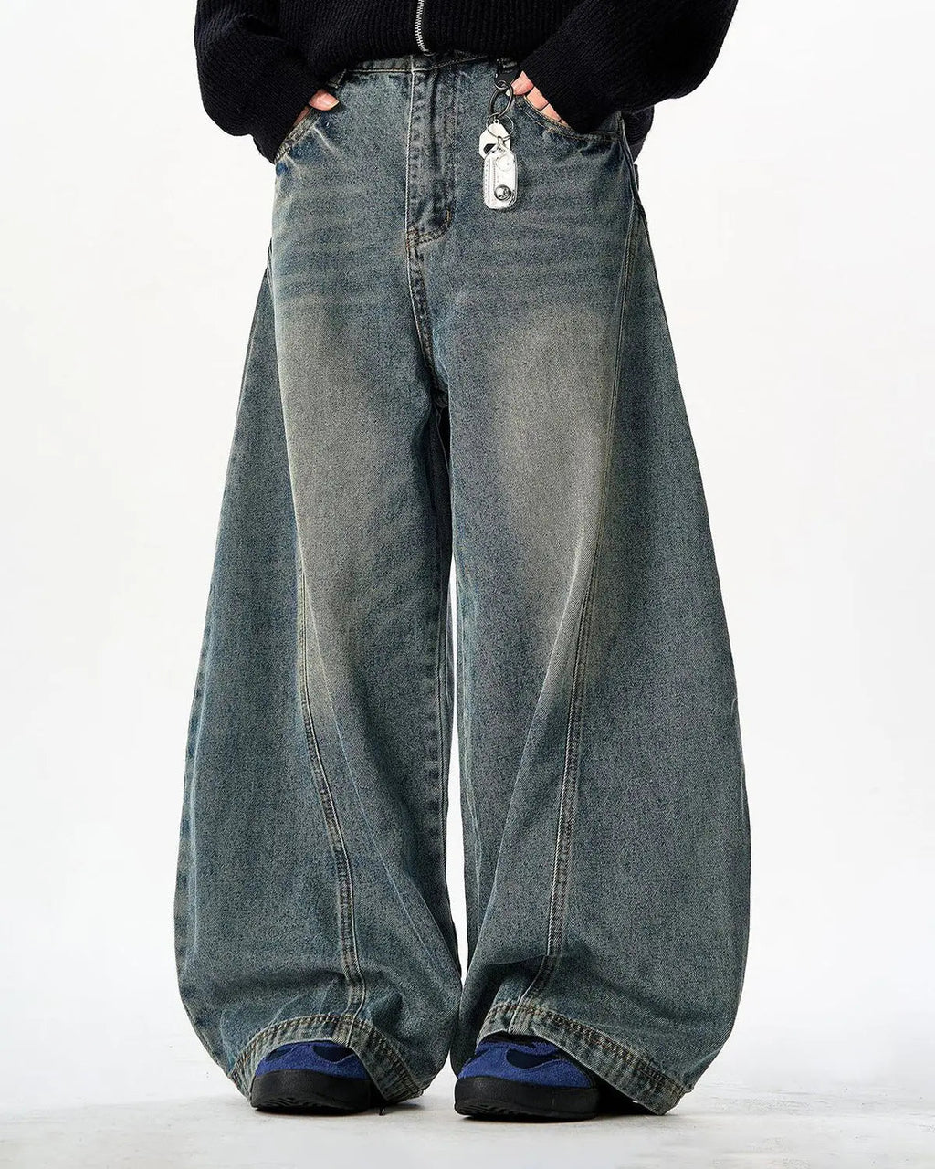 Vintage Washed Barrel Jeans by INFLATION featuring distressed denim and relaxed fit, displayed on a mannequin.