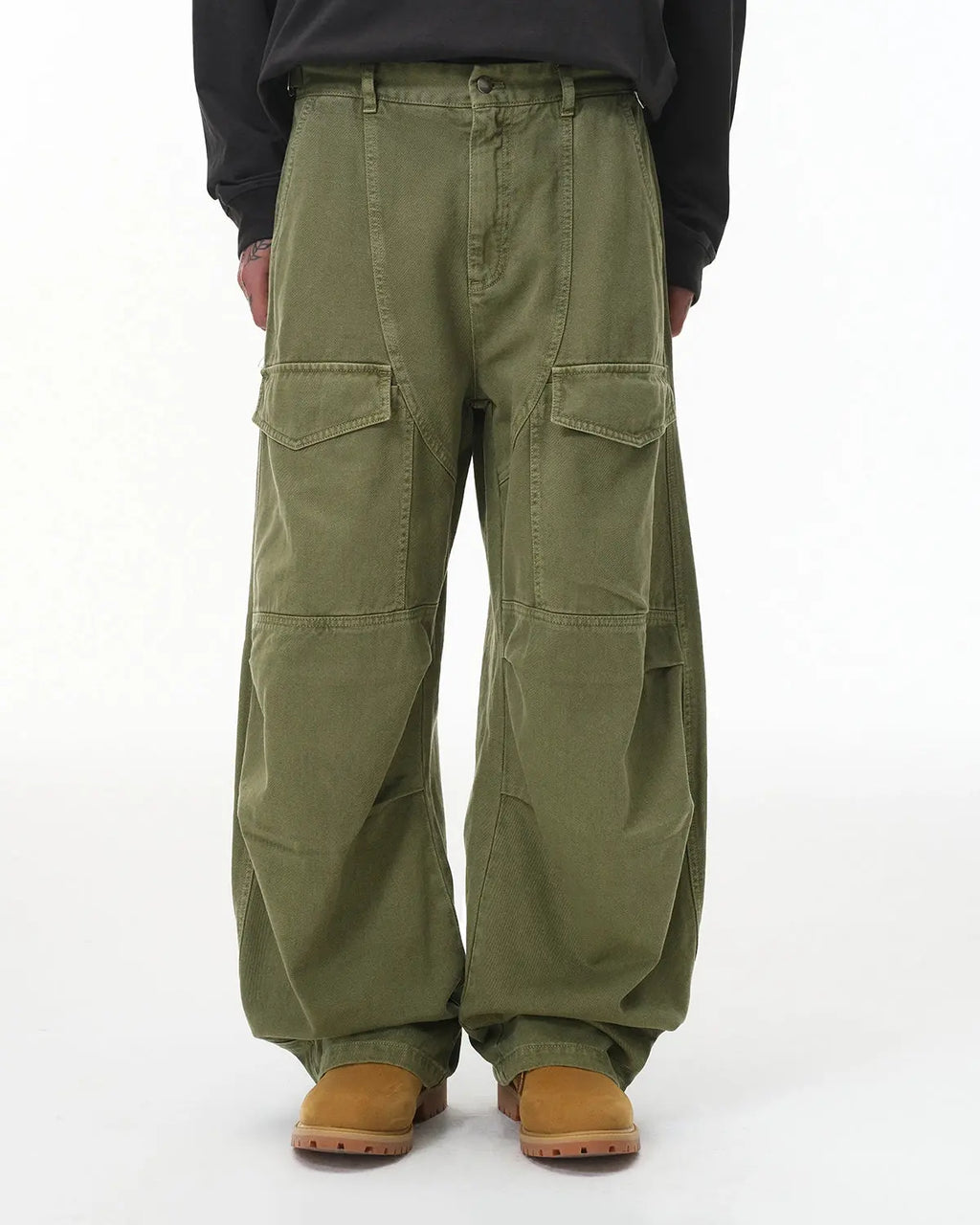Flation brand cargo pants with multiple pockets, garment washed for a casual streetwear look, displayed on a person.