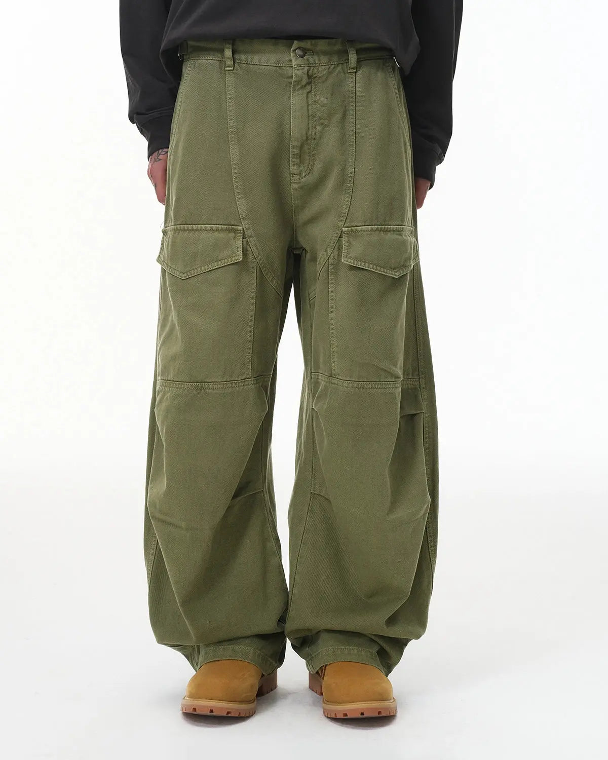 Flation brand cargo pants with multiple pockets, garment washed for a casual streetwear look, displayed on a person.