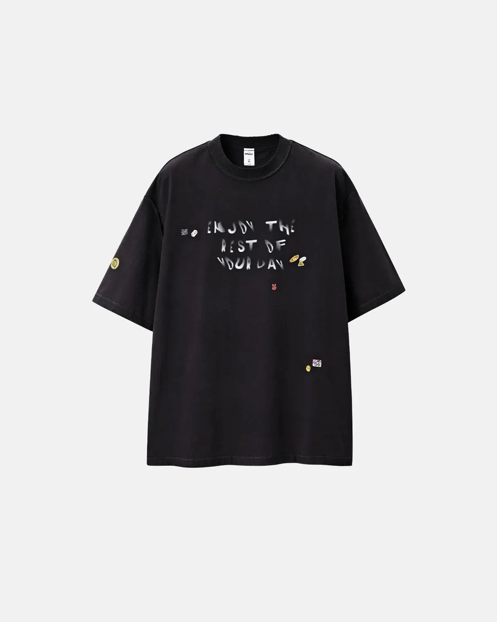 Vintage sticker graphic oversized T-shirt by INFLATION featuring bold, colorful retro-inspired sticker prints on soft cotton fabric.