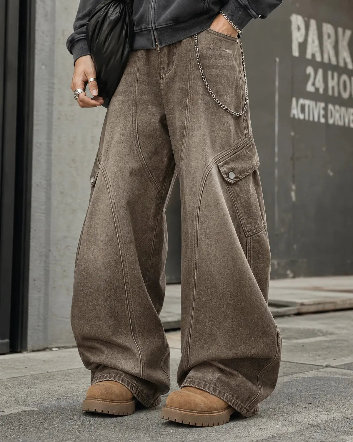 Brown acid wash barrel jeans from Flation Streetwear with distressed denim and relaxed fit, styled for casual street fashion.
