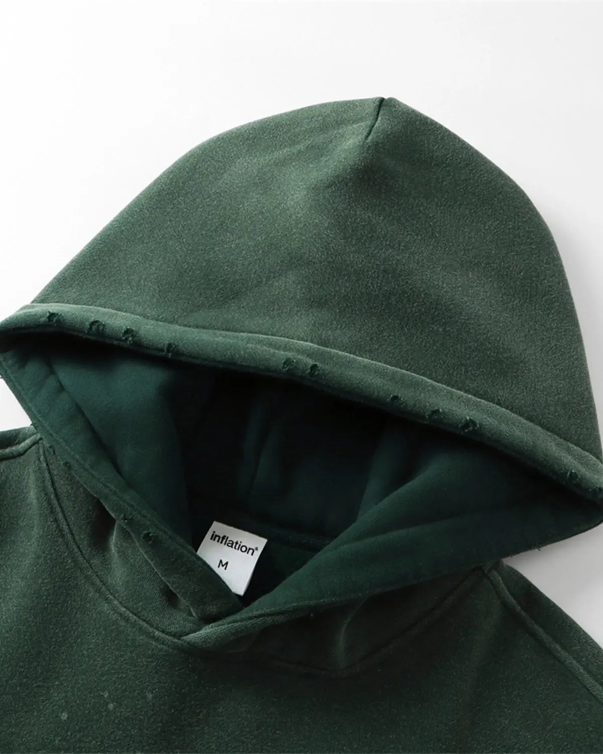 Acid washed ripped fleece hoodie by Flation, featuring distressed details and a relaxed streetwear style.