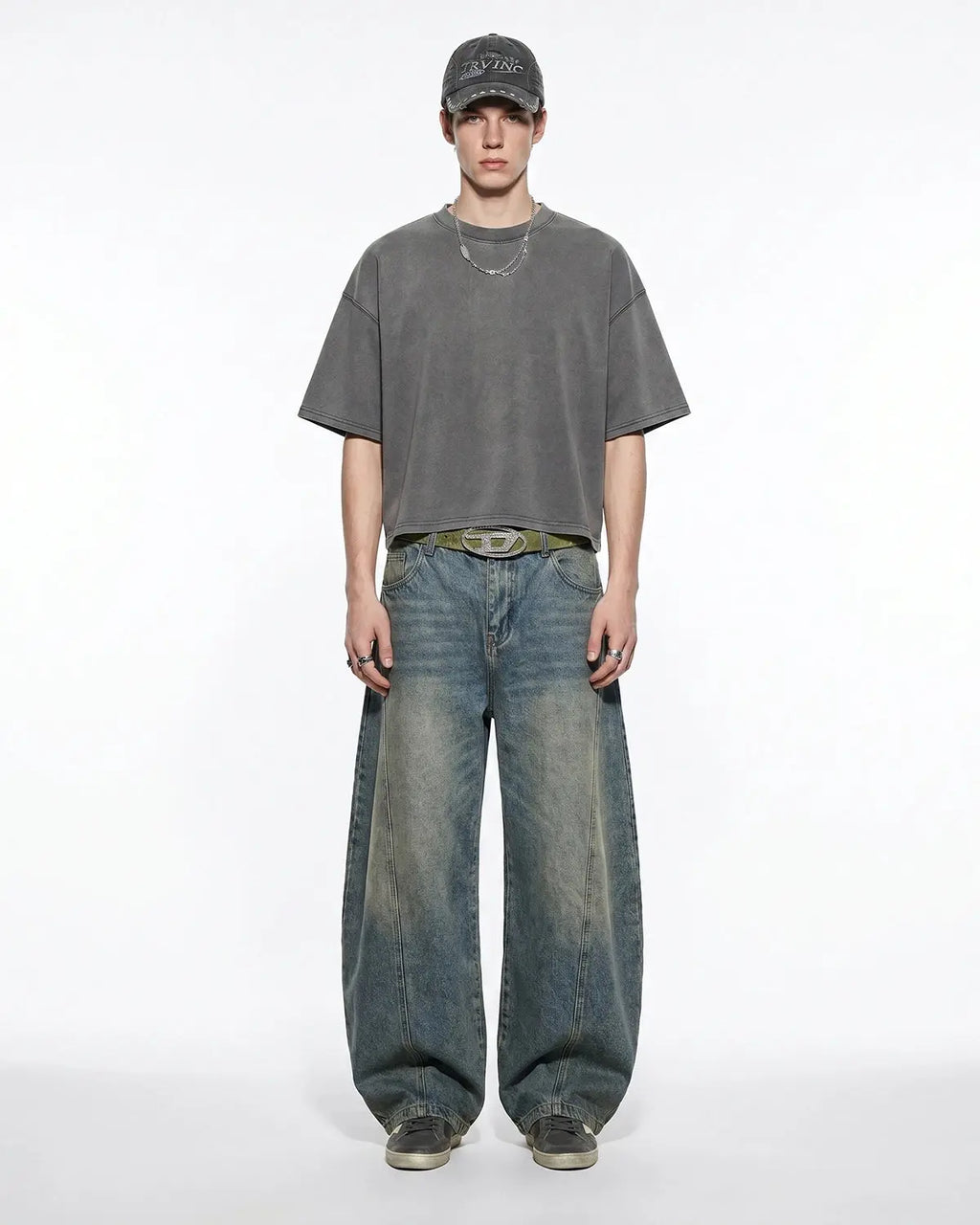 Distressed boxy washed T-shirt by Flation Streetwear, showing a relaxed fit with faded, vintage-inspired design and raw hem details.