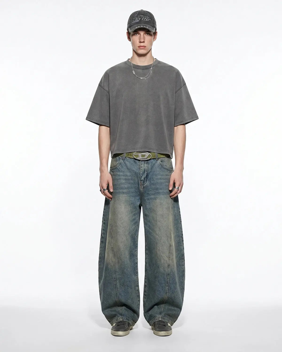 Distressed boxy washed T-shirt by Flation Streetwear, showing a relaxed fit with faded, vintage-inspired design and raw hem details.