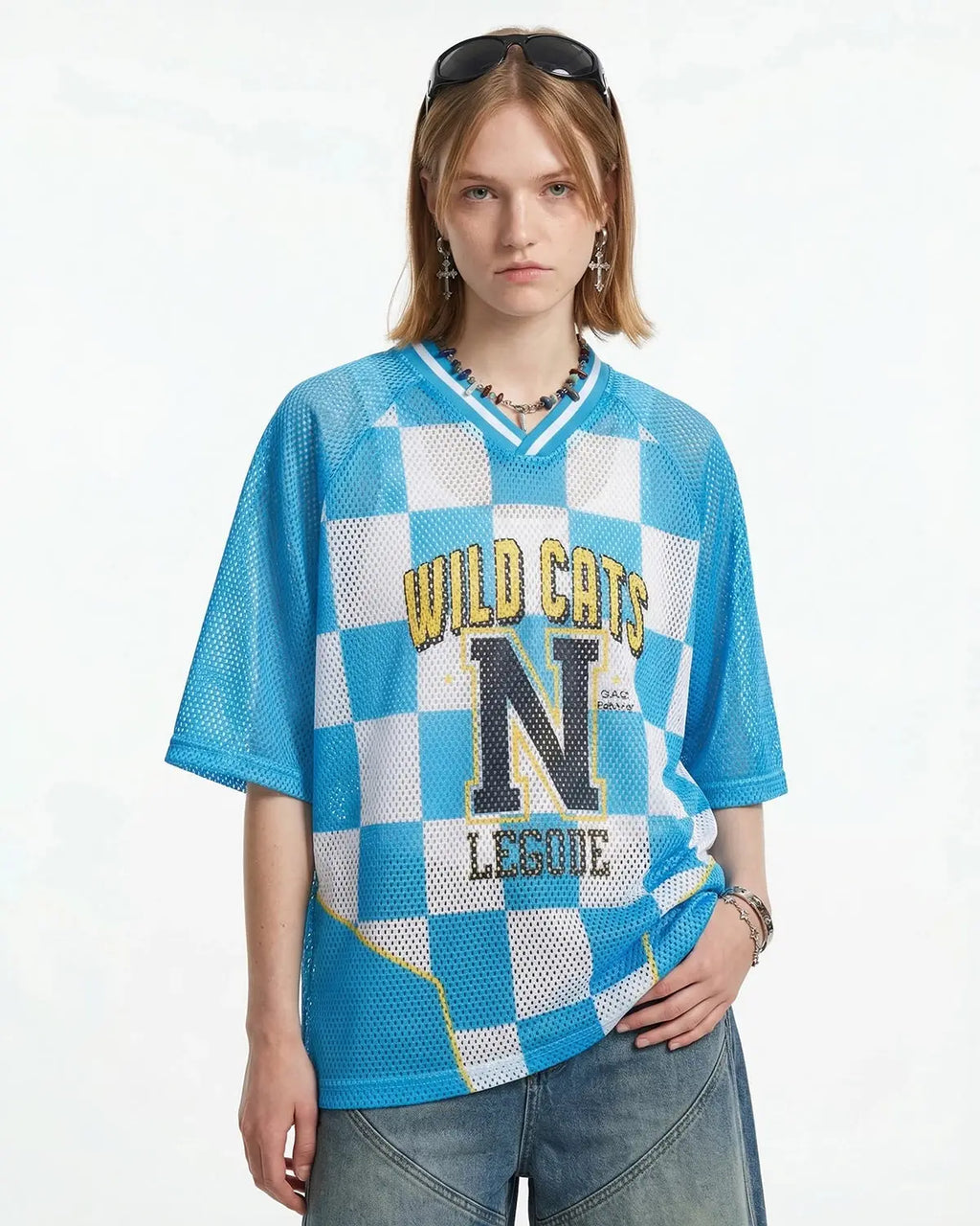 Varsity checkerboard mesh jersey by INFLATION featuring black and white pattern, athletic style, and breathable fabric.