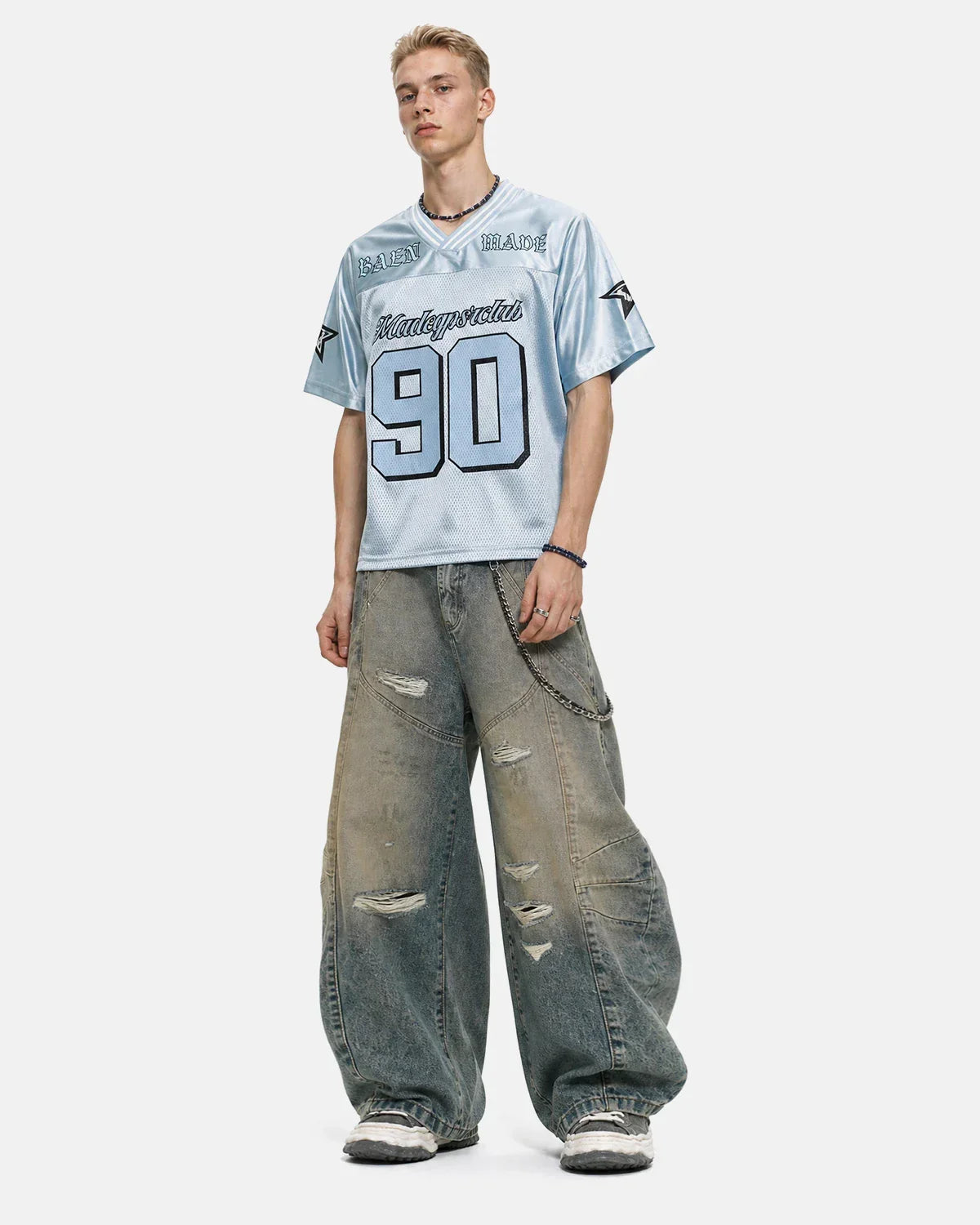 Distressed dirty wash barrel jeans by INFLATION, showcasing a rugged, faded denim design with distressed details and relaxed fit.