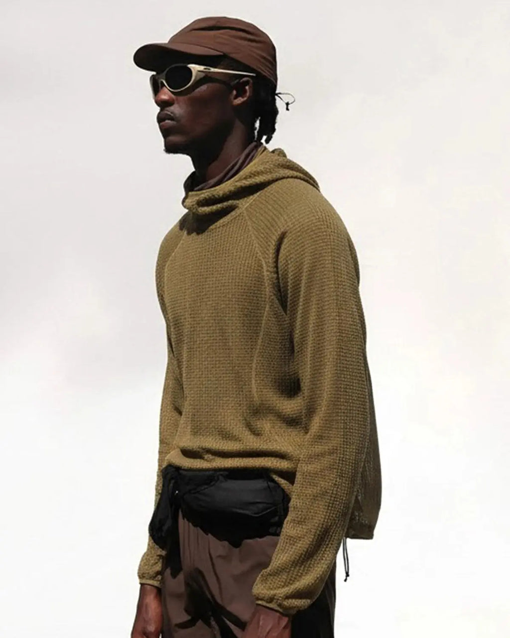 Flation Thermolite® lightweight grid texture hoodie featuring a stylish streetwear design with a hood and textured fabric.