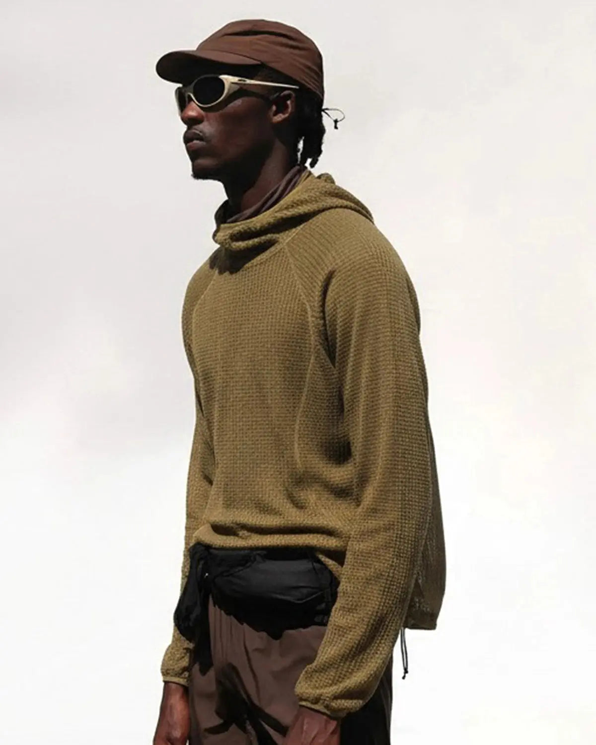Flation Thermolite® lightweight grid texture hoodie featuring a stylish streetwear design with a hood and textured fabric.