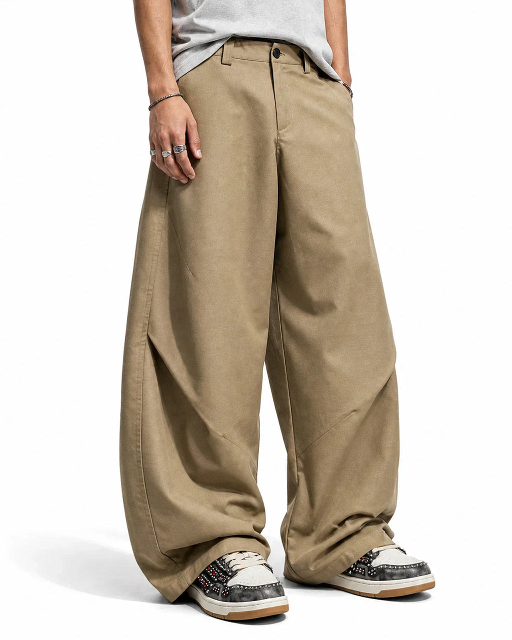 Flation pleated barrel tailored pants with high waist and relaxed fit, shown in neutral fabric on a mannequin.