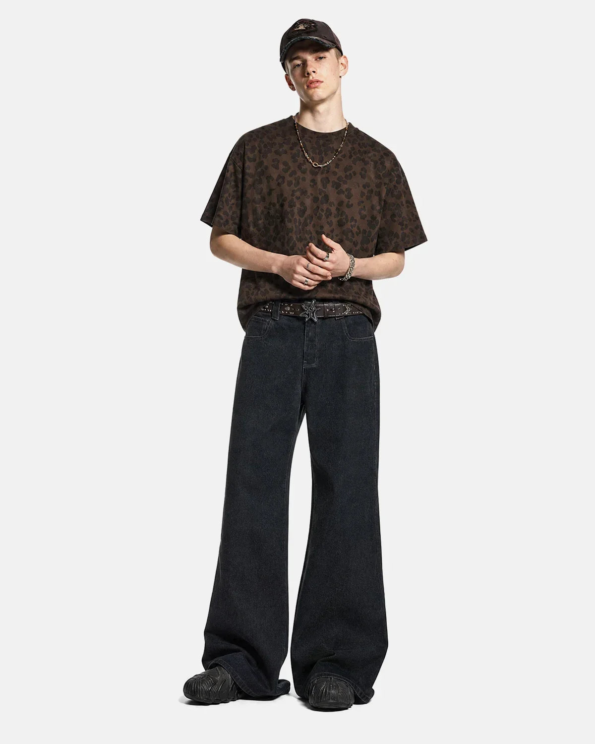 Flation Super Raw Flared Baggy Jeans with distressed details, relaxed fit, and streetwear style, shown on a model.