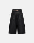 Raw denim longline cargo jorts by INFLATION, featuring distressed details, multiple pockets, and a relaxed, oversized fit.