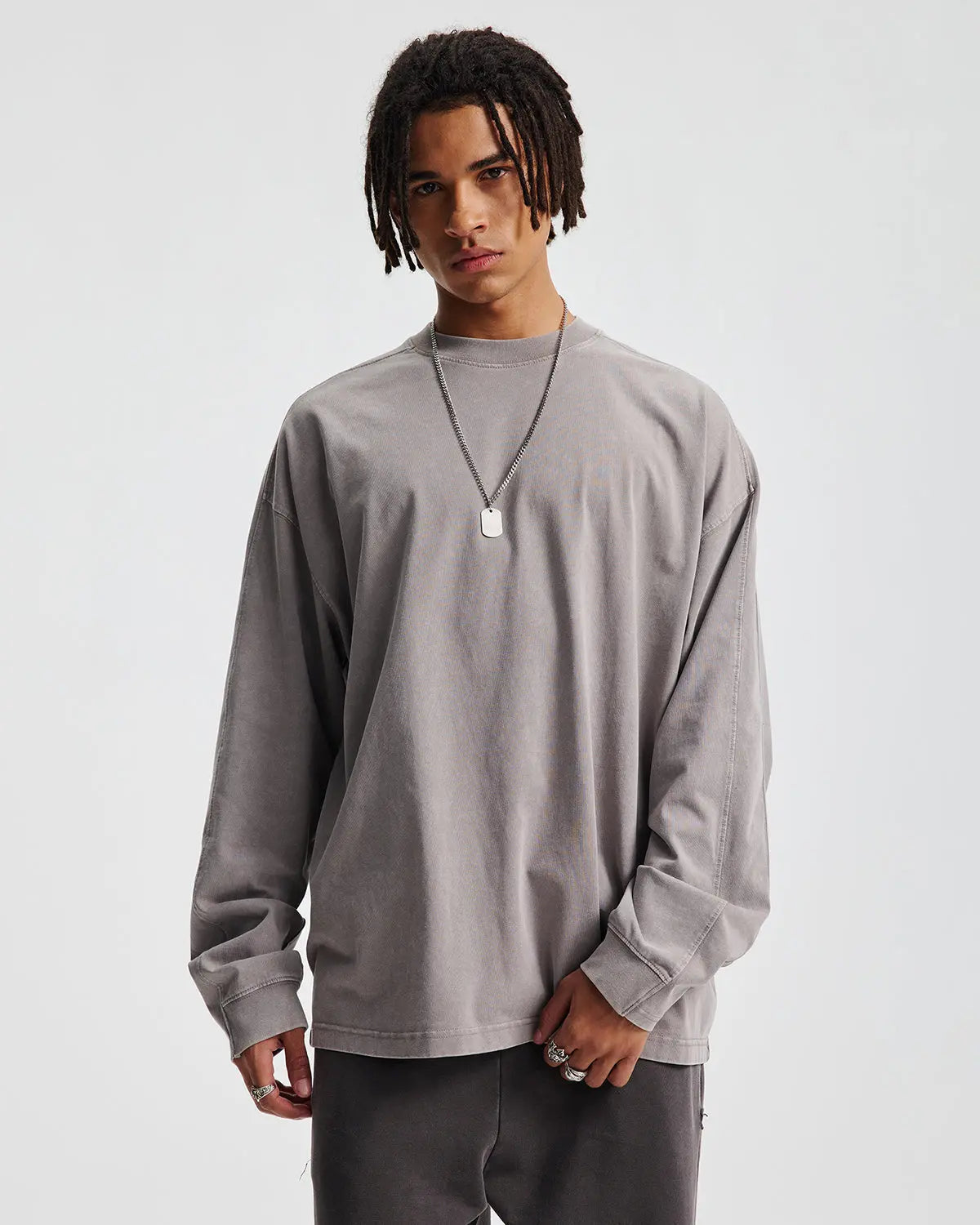 Distressed acid wash oversized long sleeve T-shirt by Flation with a relaxed fit and vintage streetwear style.