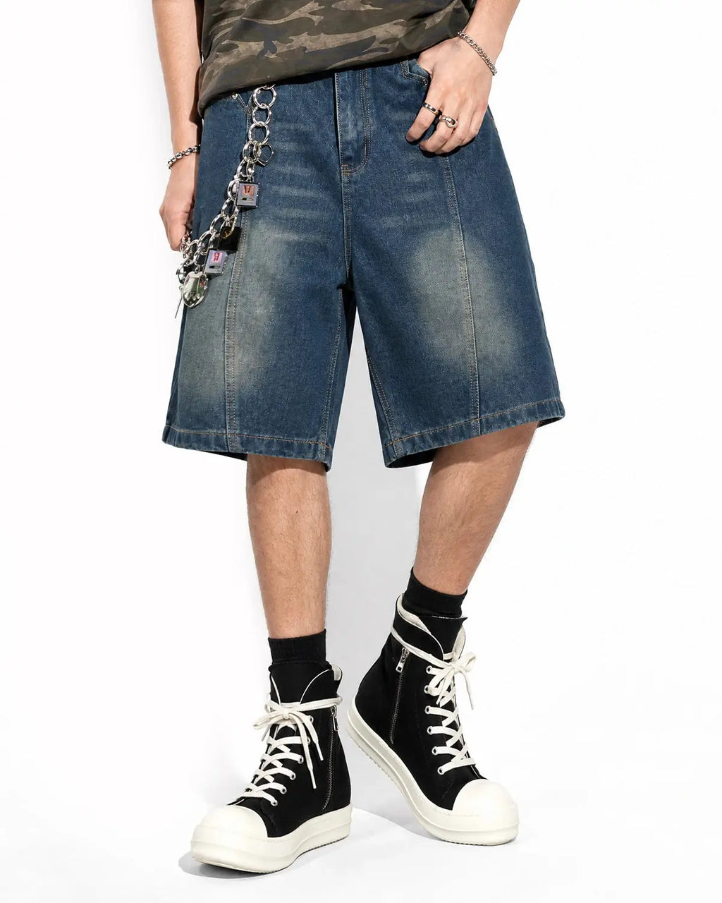 Deconstructed washed denim jorts by INFLATION, stylish streetwear pants with frayed edges and a relaxed fit.
