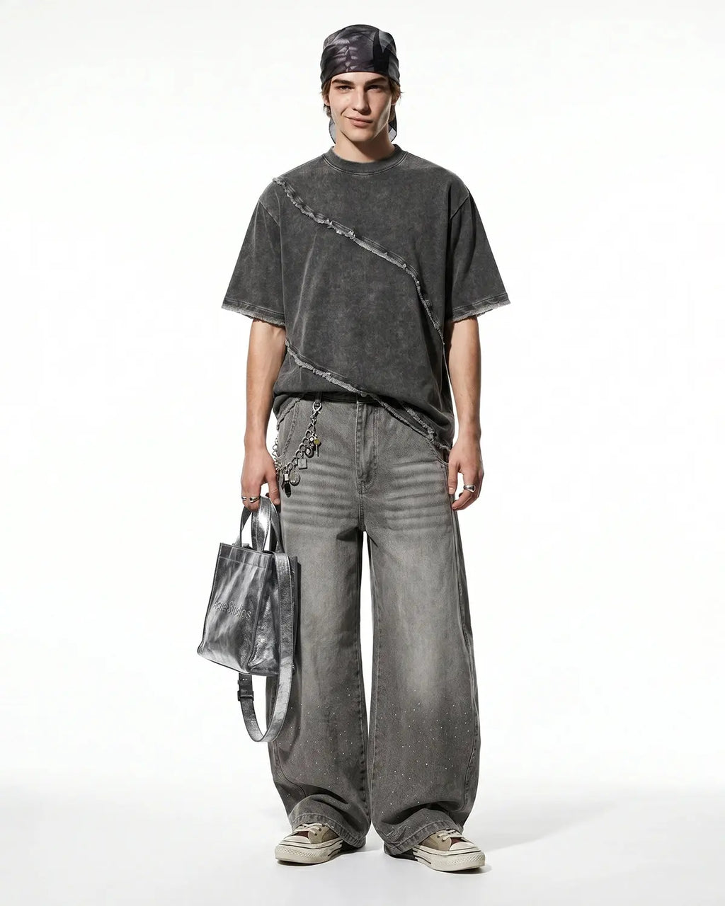 Raw edge deconstructed T-shirt from Inflation Streetwear with distressed fabric and casual fit, shown on a model.
