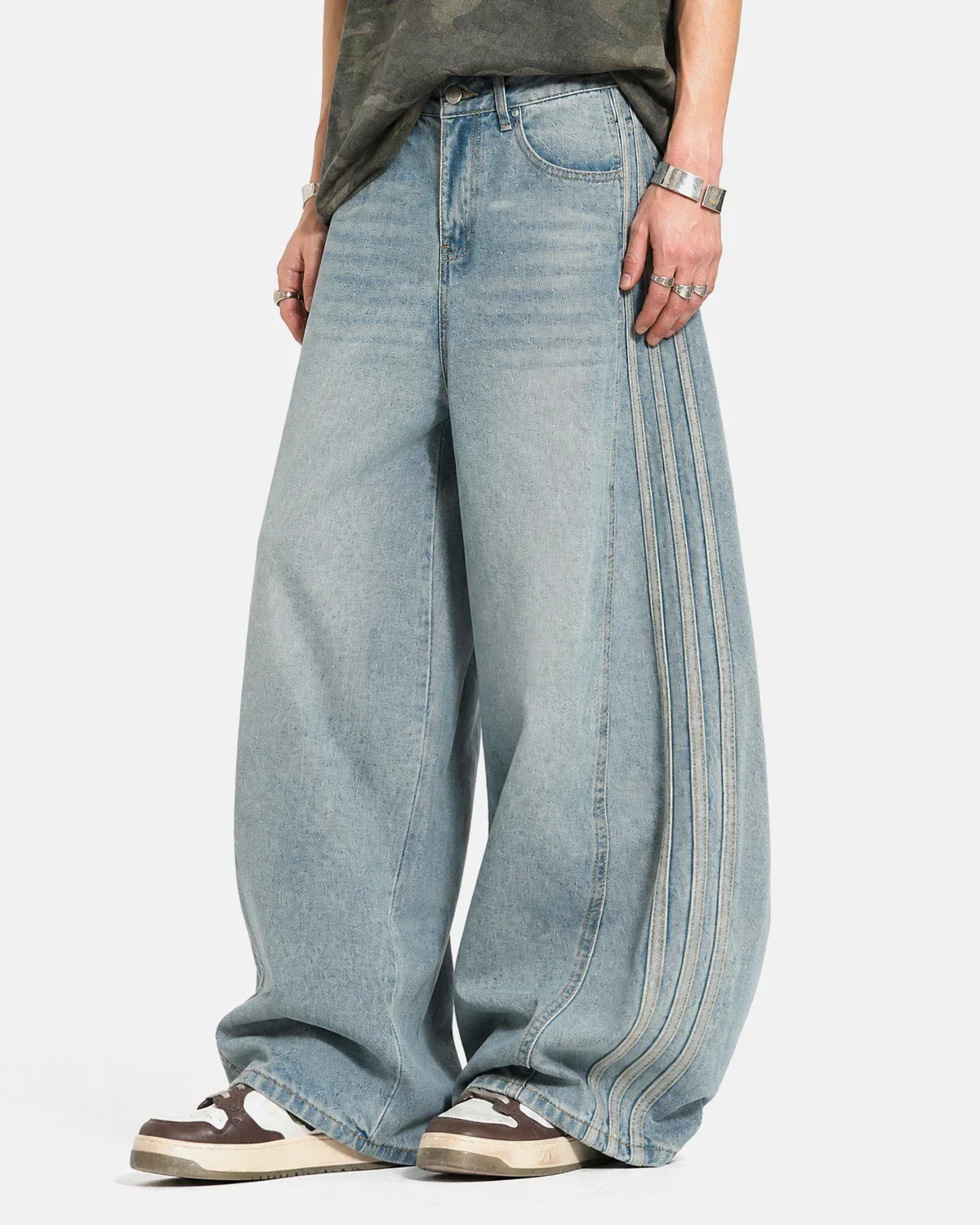 Acid wash striped side baggy jeans by INFLATION, featuring a relaxed fit and bold striped pattern for streetwear style.