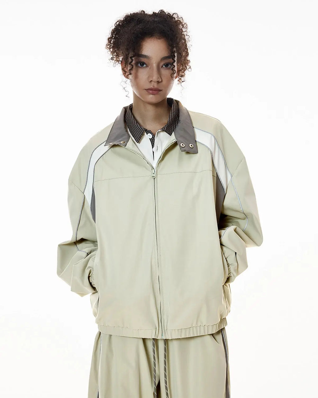 Reflective Flation streetwear windbreaker track jacket with adjustable hood and sporty design, ideal for active outdoor wear.
