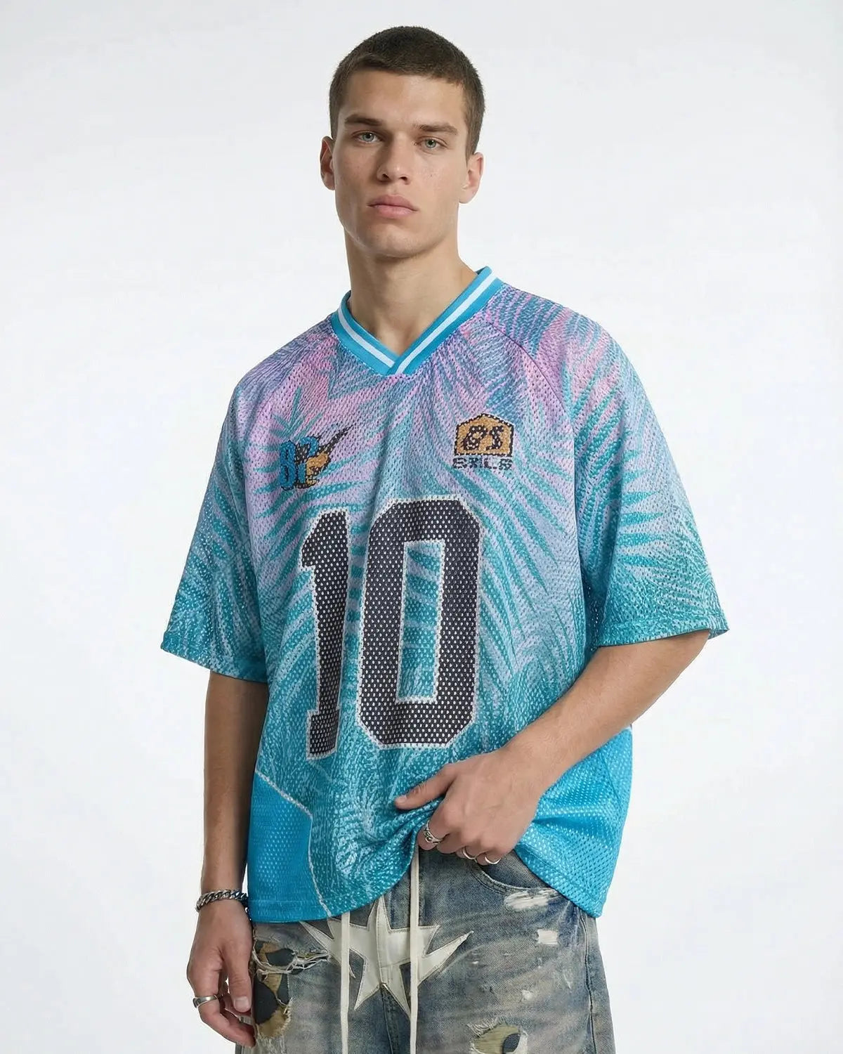 Oversized mesh football jersey by INFLATION, featuring breathable fabric and bold team graphics, perfect for streetwear style.